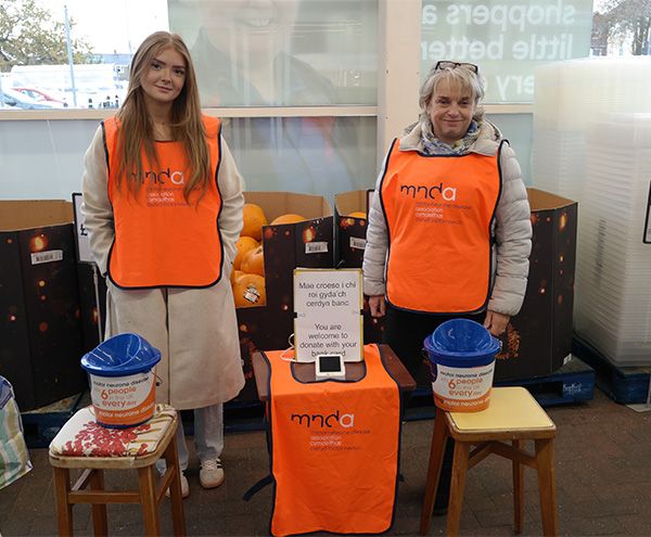 Two MND volunteers collecting money at Tesco in Porthmadog